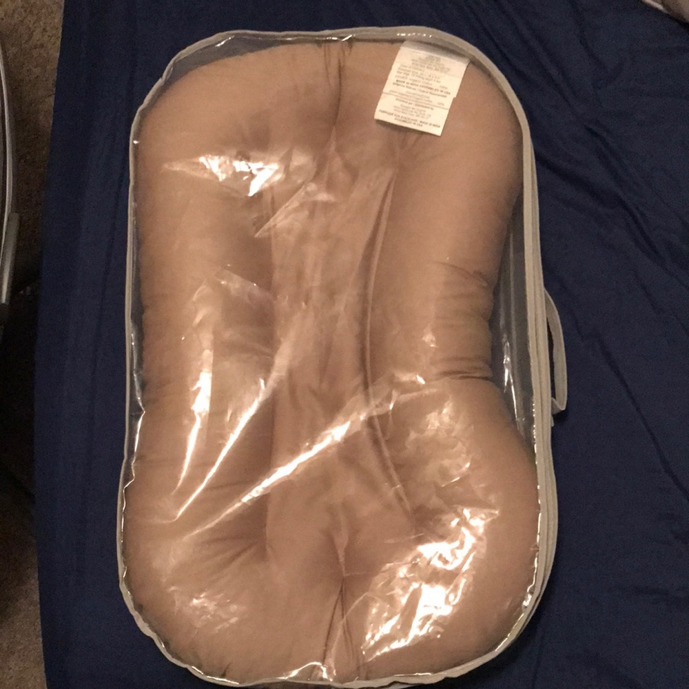 Snuggle Me Organic in brand new condition. Never used. Tan color